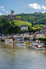 Cochem, Germany - September 9, 2025: Panoramic view of the Moselle River in the town of Cochem with Reichsburg Castle in the background