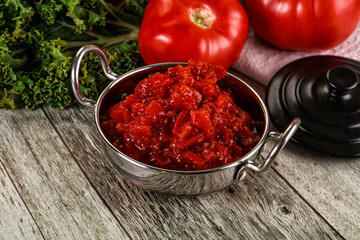 Diced ripe tomato with sauce