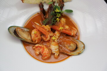 A close-up shot of a gourmet seafood dish with vibrant colors and appetizing presentation