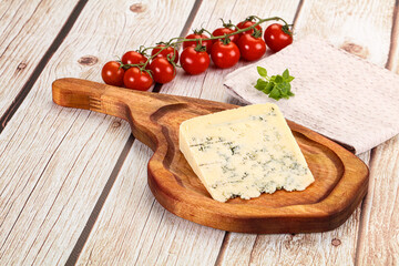 Blue cheese with mold over board