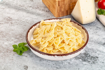 Italian pasta Farfalle with oil