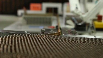 High-definition footage of an automated cleanroom assembly where glass ampoules are washed, filled with injectable medication, sterilized, and hermetically sealed. Showcases precision robotics, strict