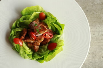 A delicious serving of meat and vegetables on a plate