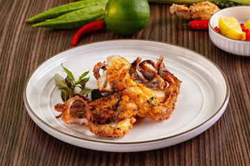 Gourmet grilled whole octopus served lime