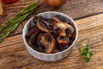Fried champignon slices in the plate