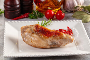Roasted rabbit leg served rosemary