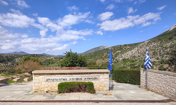 Photo of the entrance to the Archaeological Museum of Mycenae, where exhibits display remarkable artifacts and treasures from the Mycenaean civilization.
