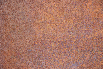 Textured surface of rusted metal with rich earthy tones, showcasing intricate patterns and natural variations, ideal for backgrounds and design projects
