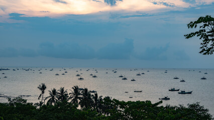 Naklejka premium beach view with fisherman boats in the evening