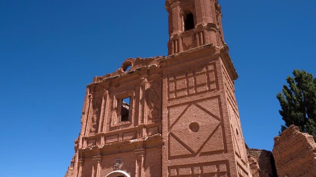 Ruins of the Convent of San Agustin in Belchite, Spain. The destroyed structure stands as a silent witness to the Spanish Civil War, showing weathered stone walls and haunting beauty under natural