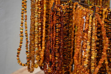 Many amber necklages in a shop