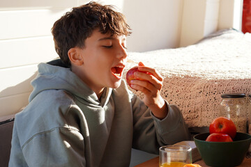 vacation and family. Preteen boy eating a healthy breakfast in a motorhome.