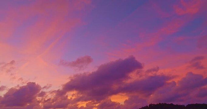 aerial view of pink cloud in blue sky at stunning sunset at the sea in sunset. 
Scene of clouds floating in colorful sky in beautiful sunset.
Gradient color. Sky texture, abstract nature background.