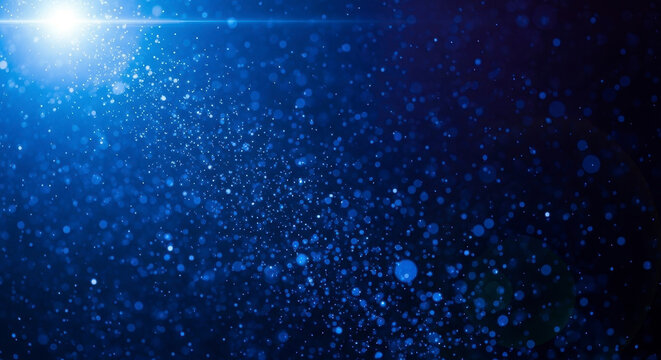 Stunning blue light burst effect with sparkling particles for magical abstract designs and festive backgrounds
