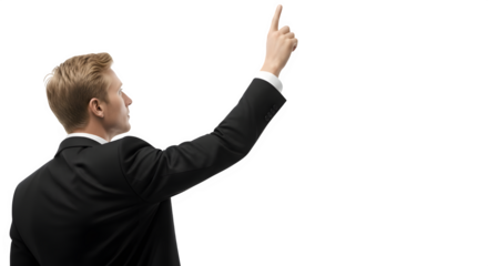 A businessman in a suit points to the upper right corner, isolated on transparent background, as he looks up and to the side in studio shot