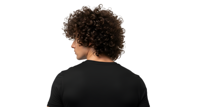 A young man with curly hair is seen from behind, isolated on transparent background, wearing a black tshirt and looking to the side in studio shot