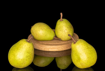 Fresh pears isolated on black glass