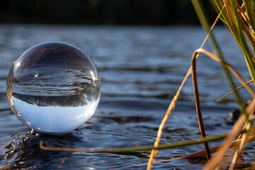 crystal reflective orb by a scandinavian lake