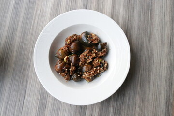 A top-down view of a serving of delicious food on a white plate 