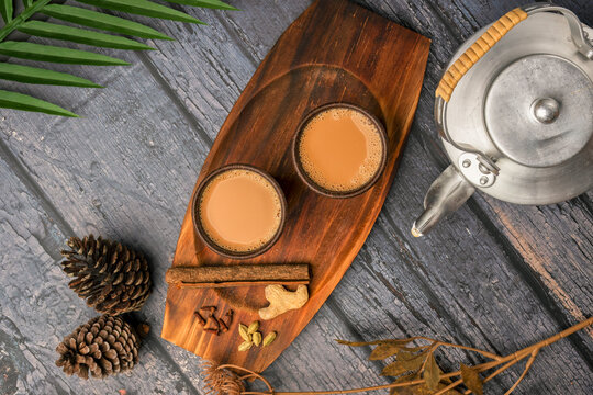 Indian masala chai tea. Masala chai spiced tea with milk and spices or karak chai or cutting chai. Tea with indian tea pod, restaurant, bar, ethnic, cafe, hotel concepts.