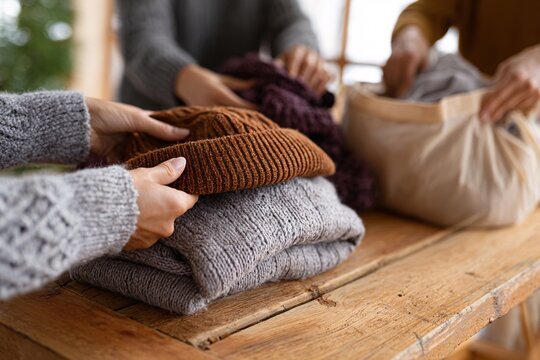 Friends and family gathering for charity clothing drive during Christmas