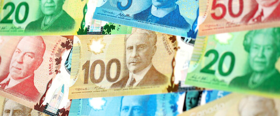 Canadian Dollar currency money bills. CAD currency banknotes in big bunch with different...
