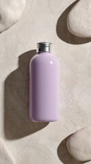 Minimalist cosmetic packaging mockup rests on a textured stone surface surrounded by smooth pebbles