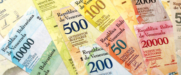 Venezuelan Bolivar currency money bills in stack. VED currency banknotes with different denomination close up