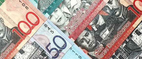 Dominican Republic Pesos currency money bills. DOP currency banknotes in big amount with different...