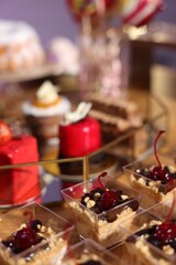 Buffet menu. Different delicious desserts on table, selective focus