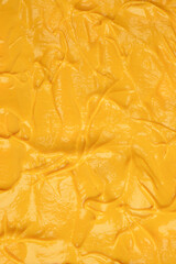 Yellow sauce splashes as a background.
