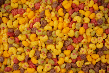 Sweet crunchy cornflakes as a background. Top view.
