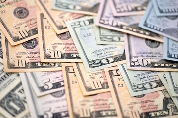 United States Dollar currency money bills. USD currency banknotes in pile with different denomination close up