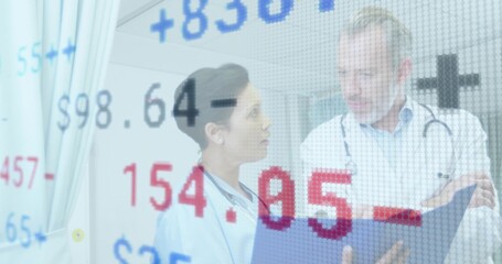 Physicians reviewing patient chart in clinic, wearing stethoscope and scrubs with numeric overlay