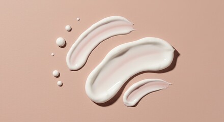 Close up of cream smears and drops on a peach colored surface , trending, fashion, lifestyle