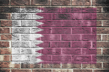 Qatar flag on old brick wall background