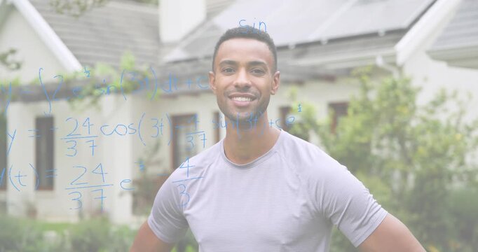 Man standing yard of house with solar panels, smiling and causing equations layering in education