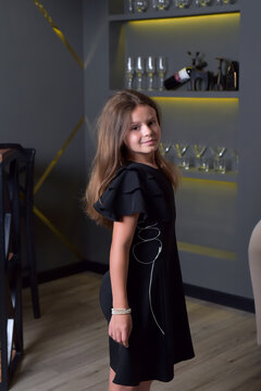 Young girl in elegant black dress 