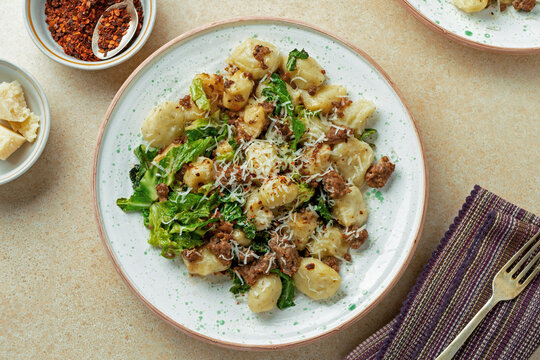 Healthy Gnocchi Dish with Kale and ground meat, top view