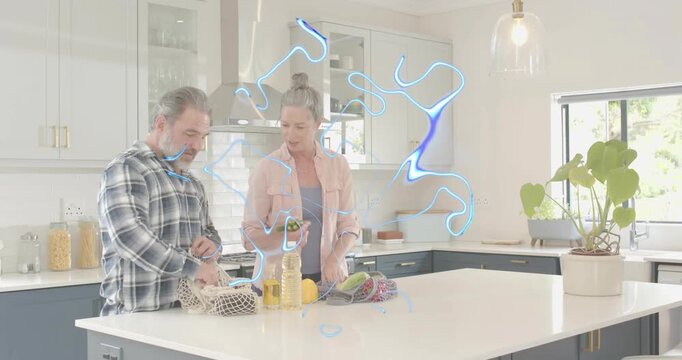 Man placing produce bag opening drawstring unpacking veggies then sharing recipe on smartphone