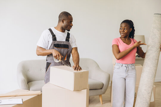 Professional mover packing boxes for relocation service