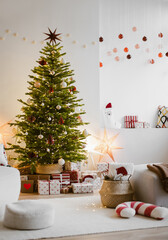Stylish christmas living room interior with christmas tree, stars, gifts and decoration. Minimal xmas interior design template. Winter holiday home decor
