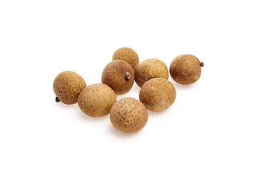 Longan tropical fruit arranged artistically on a white background, showcasing its round shape, textured skin, and natural earthy tones, ideal for culinary or health-related concepts