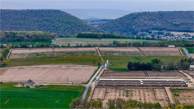 Aerial landscape of corn and guinea fowl poultry farm rural Appalachia Central Pennsylvania