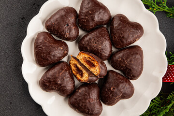 Gingerbread chocolate heart shaped honey cakes Christmas sweet dessert new year natural product tasty snack fresh delicious gourmet food background on the table rustic top view copy space