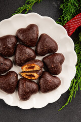 Gingerbread chocolate heart shaped honey cakes Christmas sweet dessert new year natural product tasty snack fresh delicious gourmet food background on the table rustic top view copy space