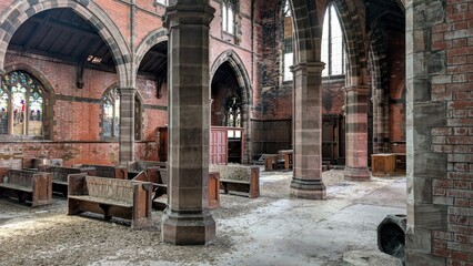 Abandoned church abbey interior. Derelict religious building arches, stone brickwork pillars. Gothic chapel architecture columns, vaulted ceiling arch, deserted pews. Closed empty old place of worship