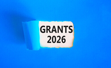Grants 2026 symbol. Concept words Grants 2026 on beautiful white paper. Beautiful blue paper background. Business and grants 2026 concept. Copy space.