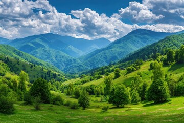 Fototapeta premium Lush green valley with rolling hills, trees, and mountains under a blue cloudy sky