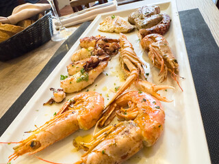 Delicious grilled seafood platter with shrimps and squid